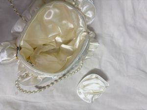 Elegant White Satin Pearl Handle Clutch