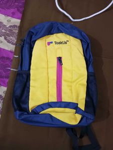 TaskUs Yellow & Blue Backpack