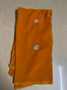 Vibrant Orange Saree with Embellishments