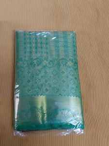 Green Embossed Soft Silk Saree