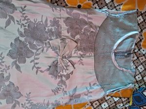 Soft pastel blue dress with elegant floral detaili