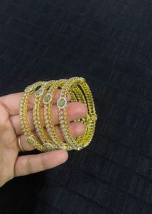 Set of 4 Designer Bangles with Green Stones