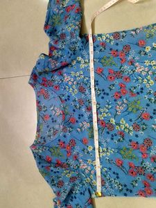 Blue floral ditsy- print top. (Material: Not sure)