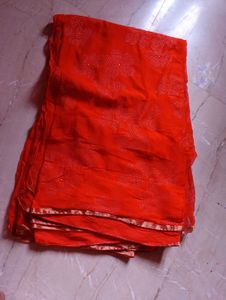 Orange Saree with Floral Embellishments