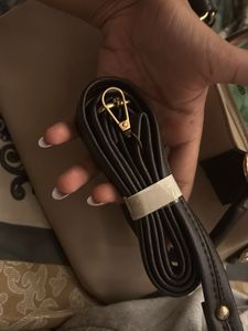 Elegant Beige Handbag with Black Handles