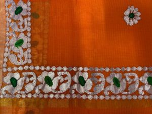 Vibrant Orange Saree with Intricate Border