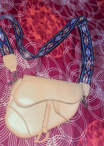 cute dior yellow bag with sling belt.