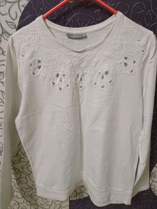 White sweater top with beautiful cut work....store
