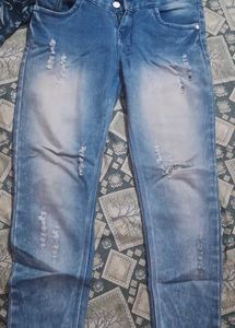 Distressed Blue Denim Jeans