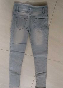 Light Wash Distressed Jeans with Patches