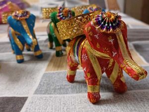 set of five elephants with diya on it