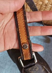 LV sling bag in mint condition, without code.