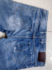 Distressed Blue Denim Jeans