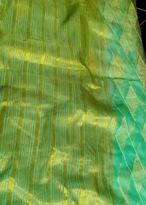 Elegant Teal Saree with white Diamond type Pattern