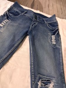 Distressed Blue Denim Jeans