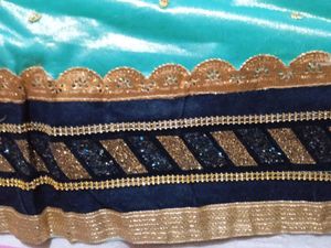 Stunning Teal Saree with Gold Border