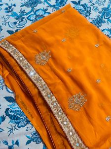 Exquisite Orange Saree with Embellishments