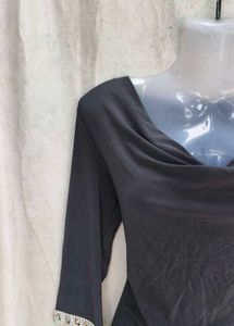 Elegant Black Dress with Embellished Sleeves