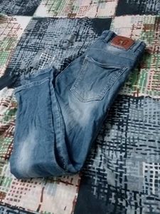 Distressed Blue Denim Jeans