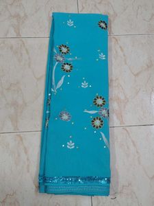 Turquoise Saree with Floral Embellishments