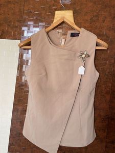 Elegant Sleeveless Taupe Top with Brooch Detail