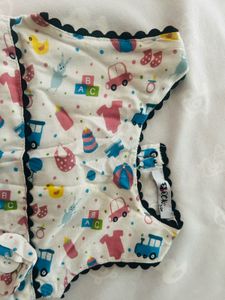 infant's white sleeveless cotton muslin frock