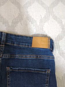 Ripped High-Waisted Blue Jeans