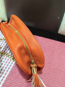 Chic Orange Crossbody Bag with Gold Chain