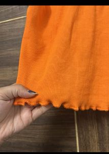 Vibrant Orange Ribbed Lettuce Hem Top