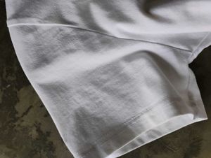 White V-Neck T-Shirt with Text Detail