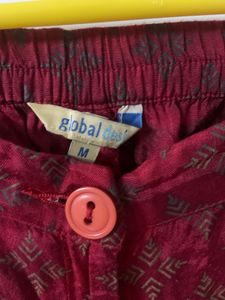 Global Desi Flared Maroon Printed Palazzo Pants