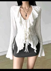 Vintage-inspired Ruffle Lace-up Top and jeans