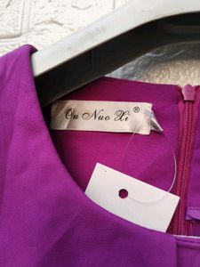 New with tag Elegant Purple Peplum Top