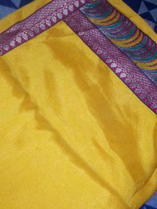 Vibrant Yellow Saree with Ornate Border