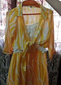 yellow dress with over coat