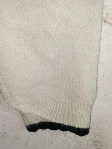 Chic Cream Knit Cardigan with Black Trim