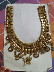 Gold Tone Butterfly Neck design