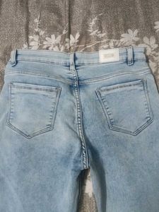 Light wash Boot cut low rise jeans for Women.