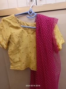 golden choli and dark pink ghaghra with duppatta