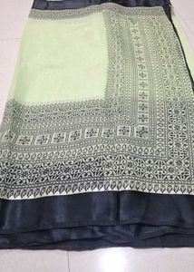 Elegant Pastel green Saree with Black Print