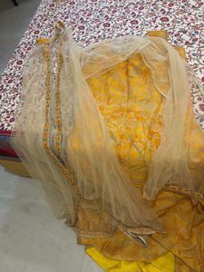 Ethnic yellow gown with shrug and dupatta