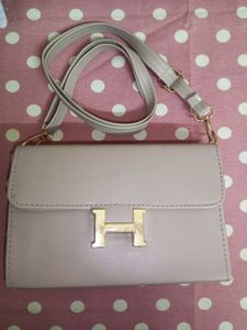 Stylish Beige Handbag with “H” Logo