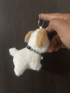 fluffy white puppy plush keychain featuring