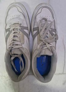 Worn White Sneakers