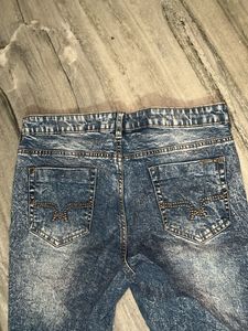 Distressed Blue Denim Jeans