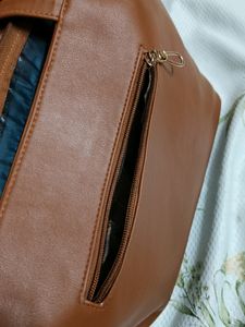"Carry your essentials in style with this Handbag"