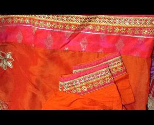 Vibrant Orange Saree with Pink Border