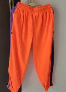 Bright Orange Joggers with Purple Stripes