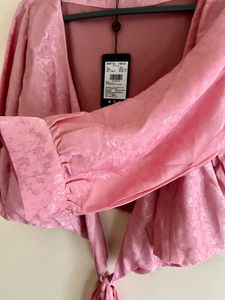 Tie on the romance in satin rose.