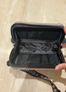 Convertible Silver Mini Luggage Style Clutch.
